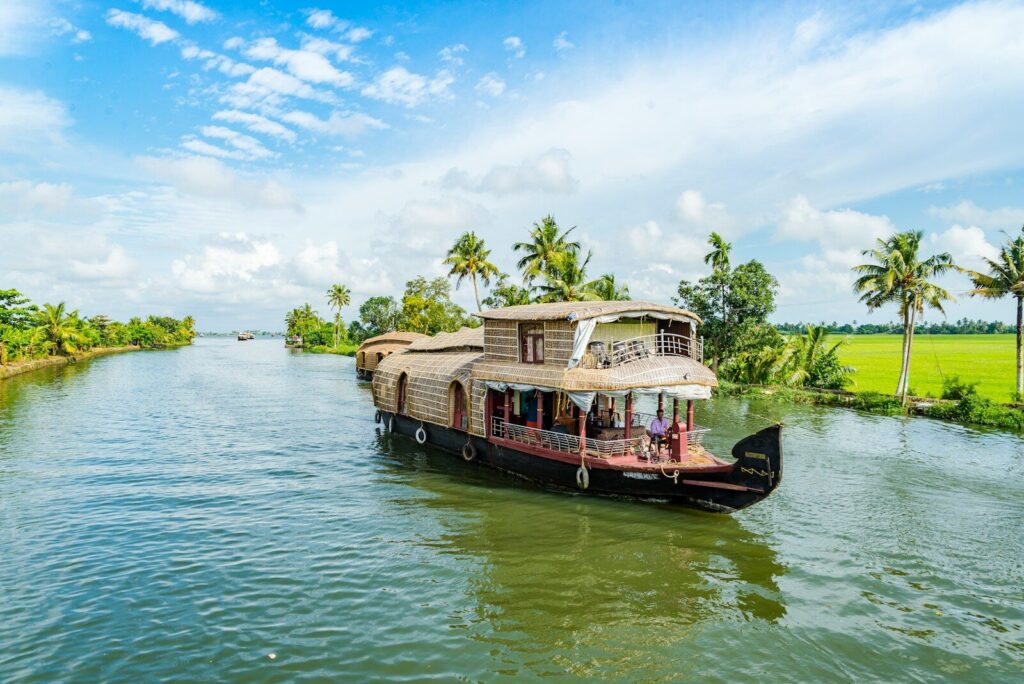 A traditional houseboat on the palm-lined backwaters of Alappuzha, India
