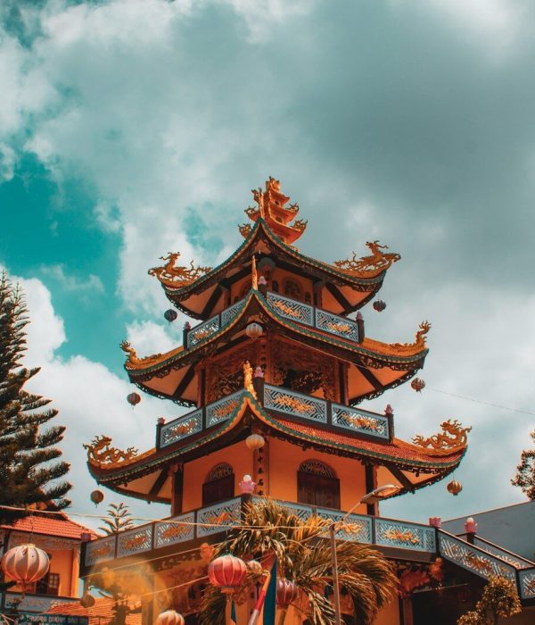brown and green pagoda temple under blue sky
