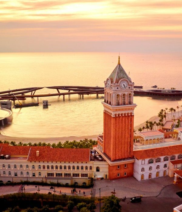 an aerial view of a city with a clock tower